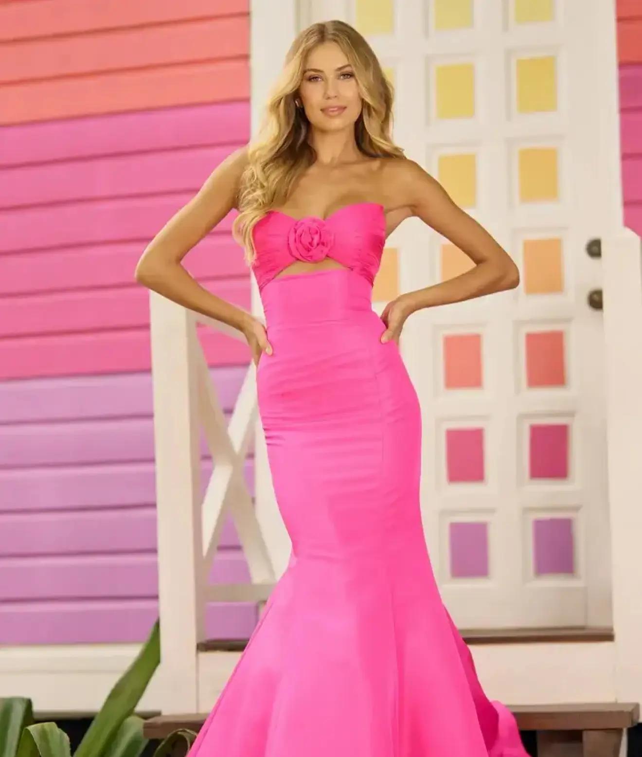 Model wearing pink Sheri Hill Prom dress